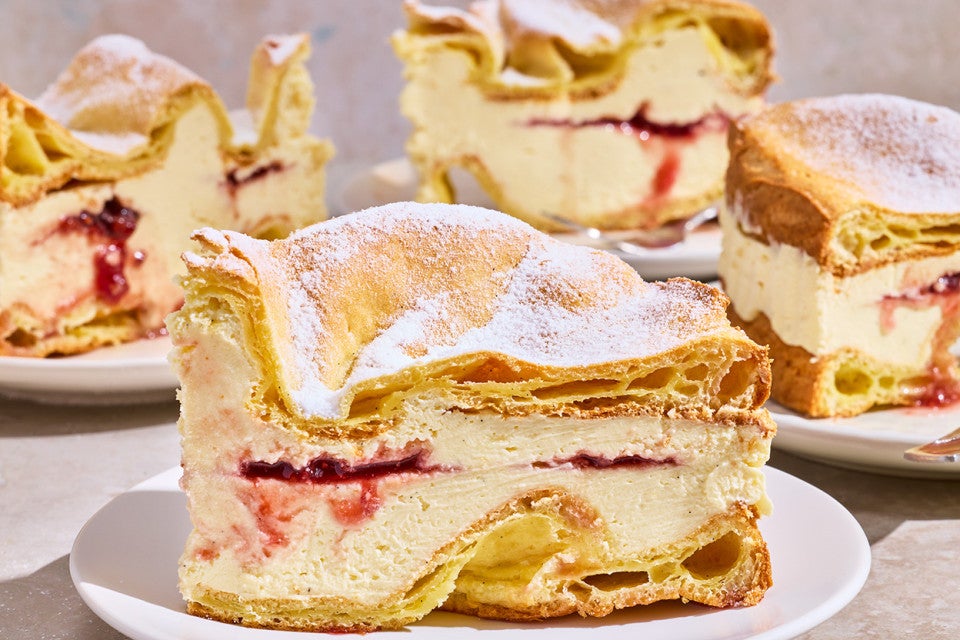 Karpatka Cake on plates showing the layers of cake and filling.