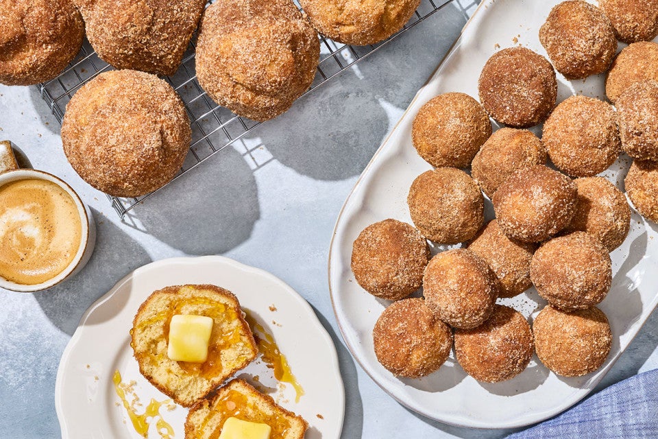 Maple French Toast Mini Muffins arranged on plates on a counter.