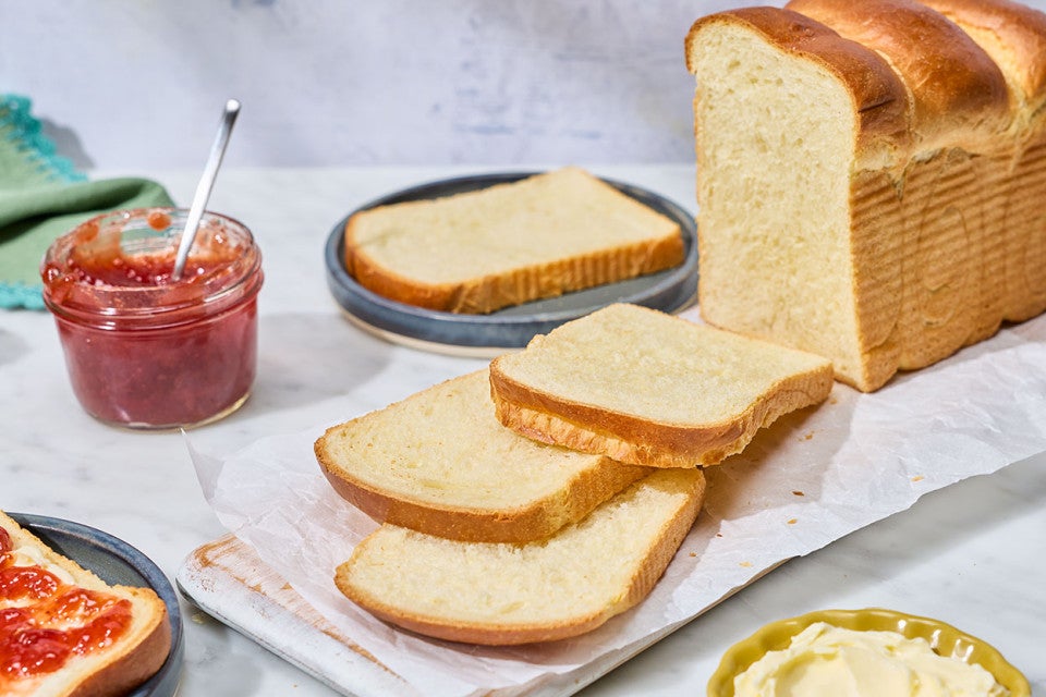 Sourdough Milk Bread sliced an arranged on a counter