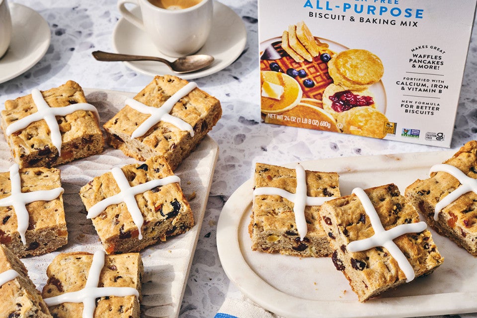 Gluten Free Hot Cross Biscuits on a counter with a box of King Arthur Baking Gluten Fee All Purpose in the background