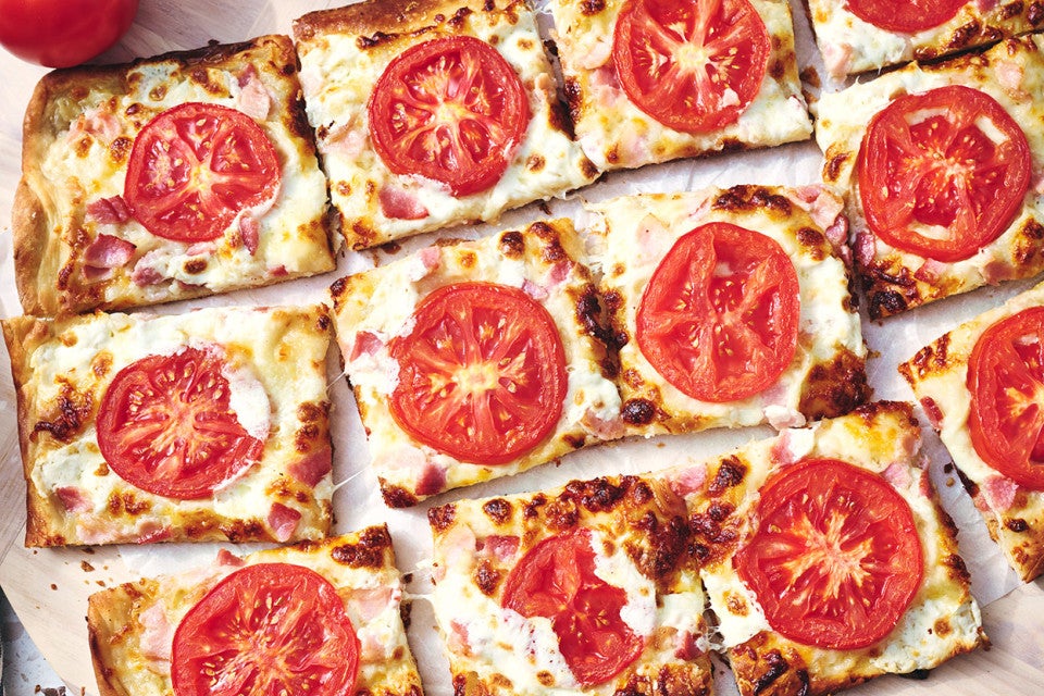 BLT Pizza sliced on a counter