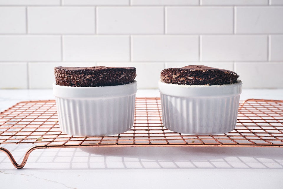 Flourless Chocolate Lava Cake in ramekins on a cooling rack