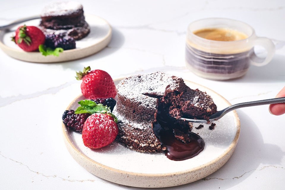 Scooping a bite from a Flourless Chocolate Lava Cake