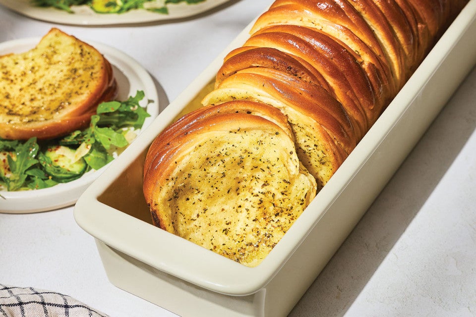 Butterflake Herb Loaf in a pan showing the buttery and herbaceous interior