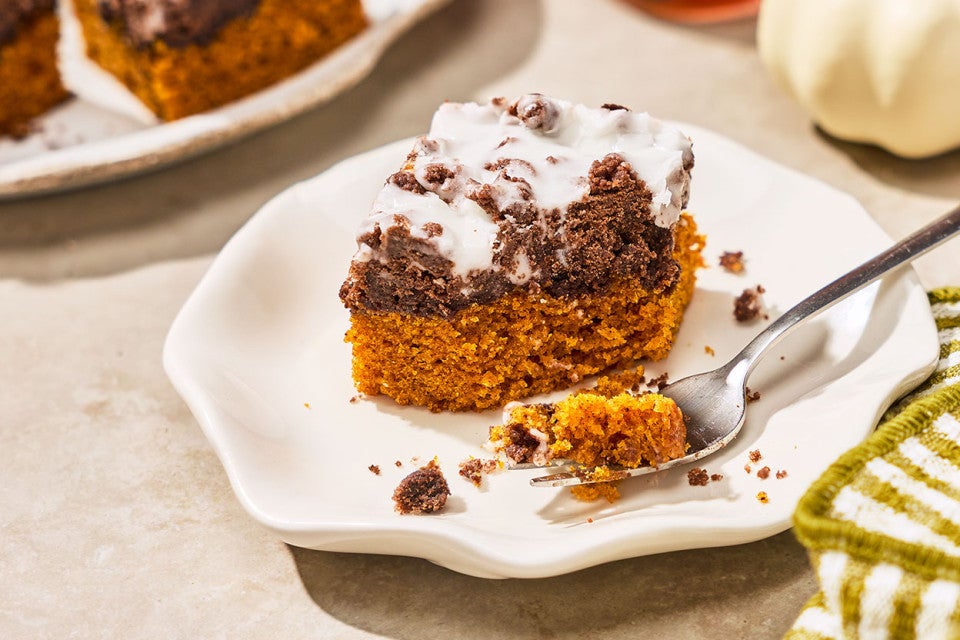 Chocolate Pumpkin Crumb Cake on a plate with a bite on a fork.
