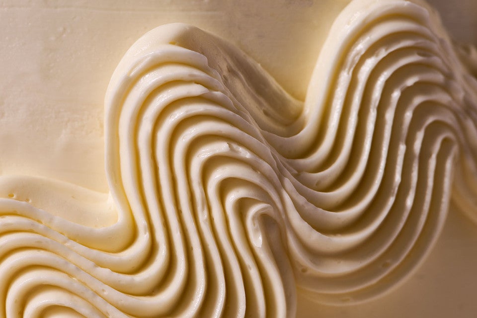 Swirled Italian Buttercream on the outside of a cake