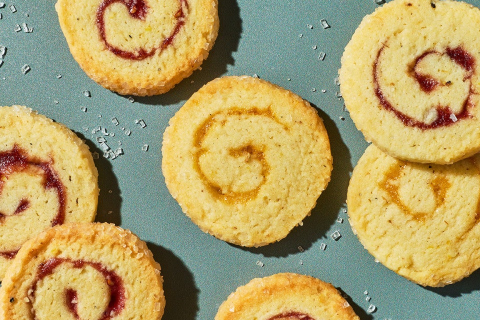 Any-Jam Pinwheel Cookies scattered on a counter