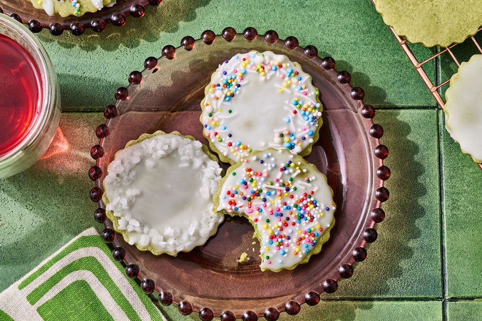 Glazed Matcha Cookies on a plate with a bite taken out of one