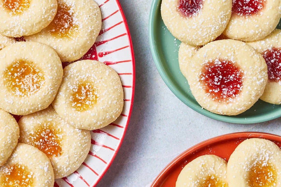 Almond Thumbprints arranged on colorful plates