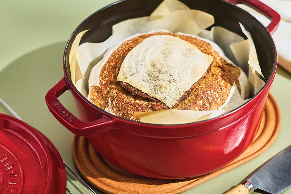 A loaf of sourdough in a dutch oven
