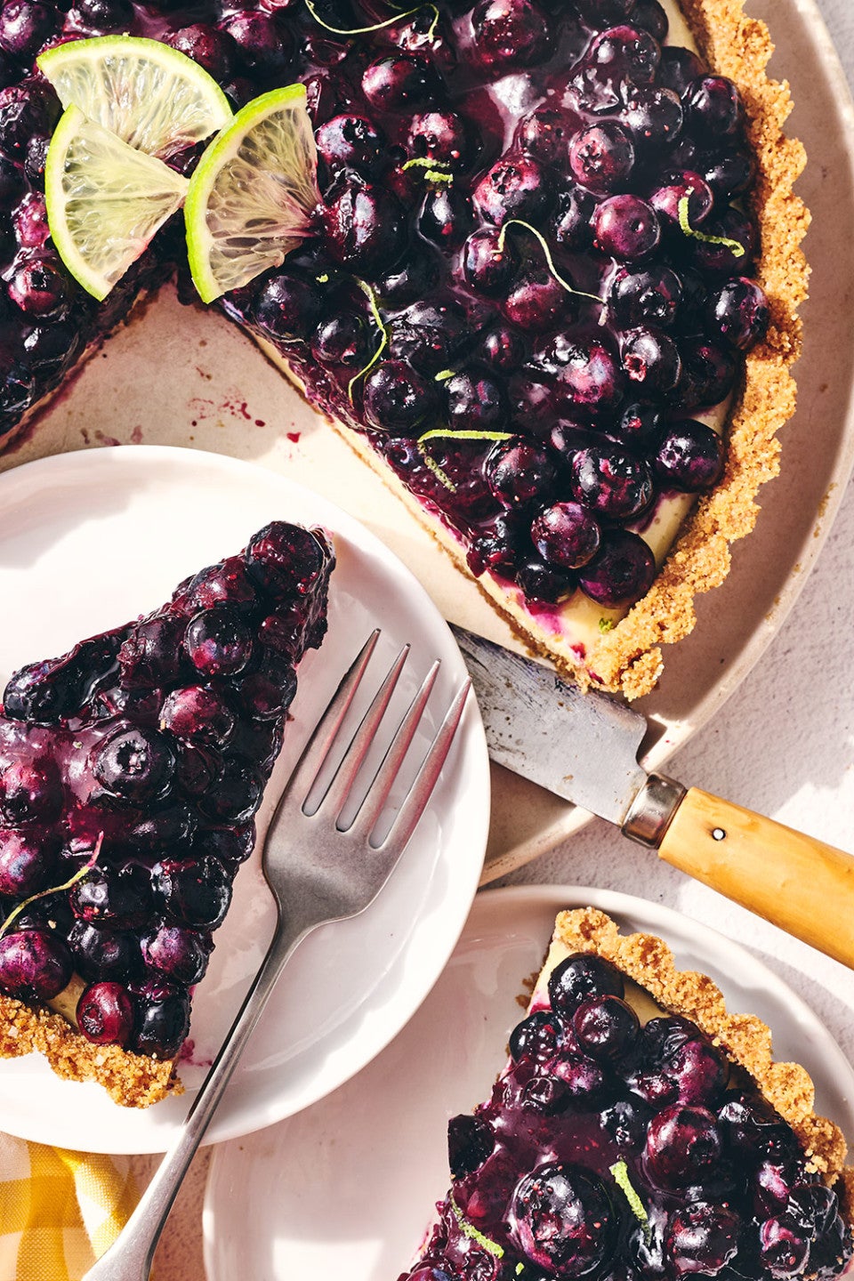 Blueberry Key Lime Tart on plates seen from above