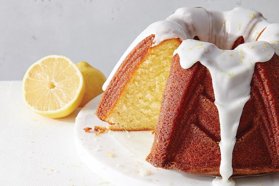 Gluten Free Lemon Bliss Cake with a slice cut out