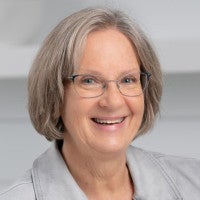 A headshot of Sue Gray