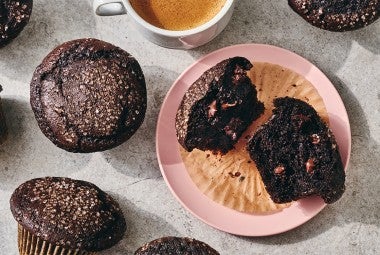 A Chocolate Breakfast Muffin broken open on a plate