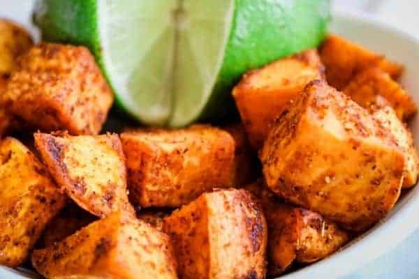 Close Up Sweet Potatoes with Lime with full lime with a slice out of it
