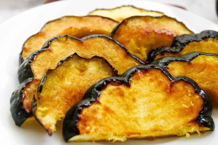 Closeup of Acorn Squash Slices on a white plate