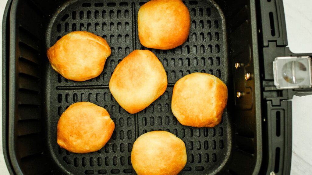 Cooked deep fried oreos in the air fryer basket.