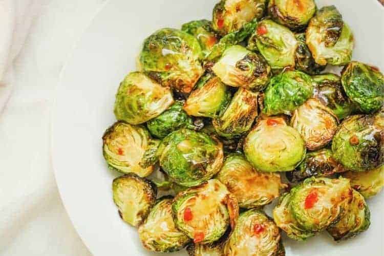 Air Fryer Sweet and Spicy Brussels Sprouts on a white plate