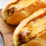 Chili Cheese Air Fryer Dogs on a cutting board