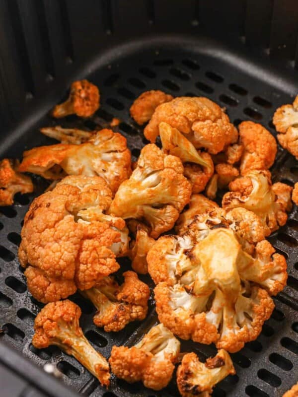 Closeup of buffalo cauliflower in air fryer basket