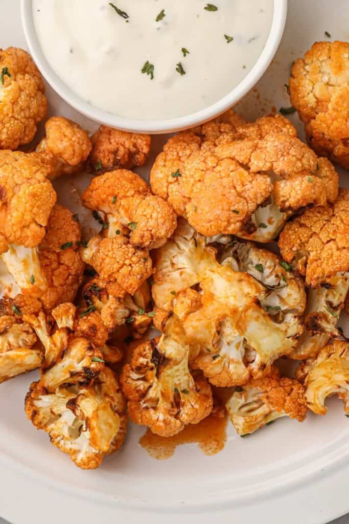 Air Fryer Buffalo Cauliflower on a plate with blue cheese