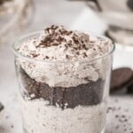 Glass filled with oreo mousse with oreo crumbs on top