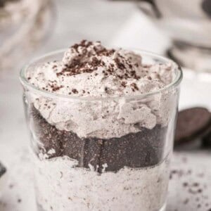 Glass filled with oreo mousse with oreo crumbs on top