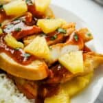 Pineapple Chicken with Pineapple Chunks on a white plate