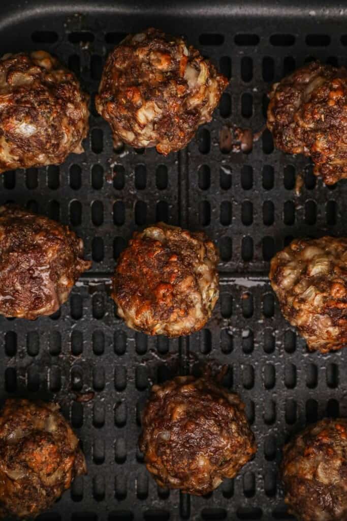 Closeup of cooked meatballs in air fryer