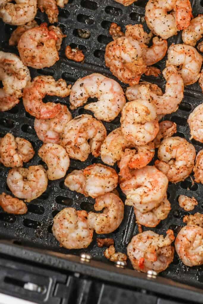 Closeup of shrimp in air fryer basket