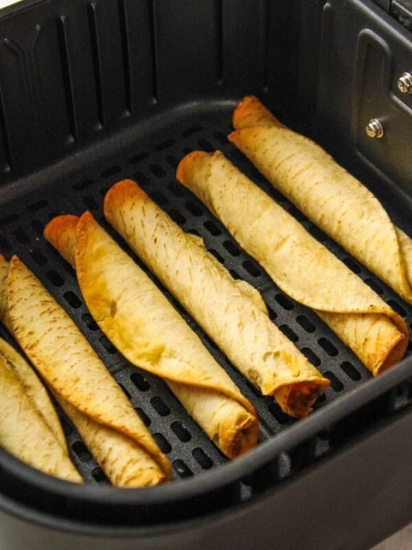 Cooked taquitos in an air fryer