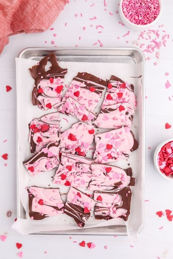 Broken up chocolate park on parchment paper