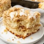 Bisquick coffee cake slice o a plate with a bite taken out of it to see the inside
