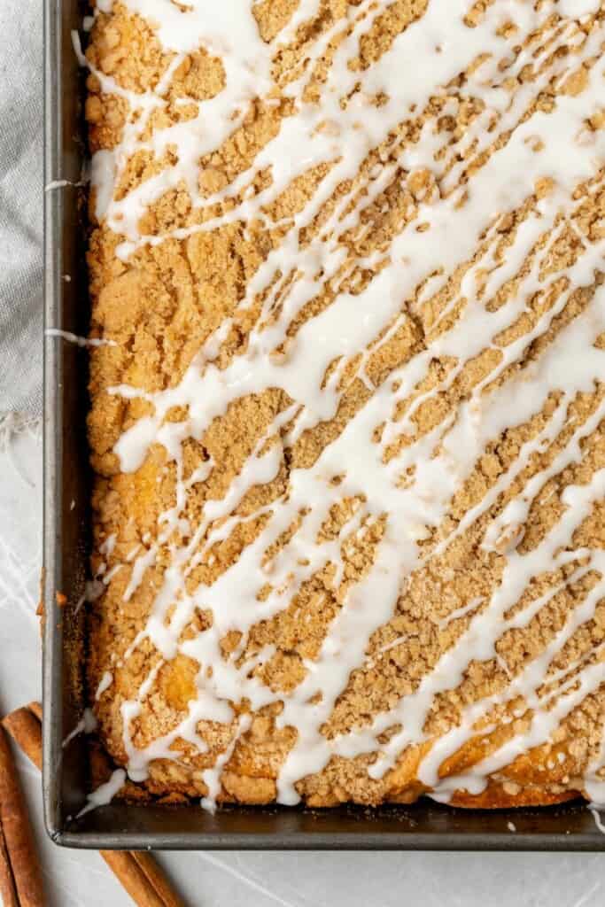 Bisquick Coffee Cake in a 13x9 pan covered with icing