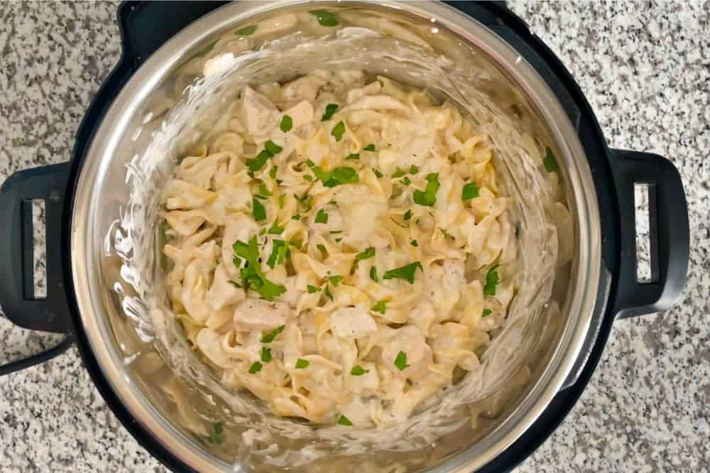 Finished Chicken Stroganoff in Instant Pot with parsley sprinkled on top