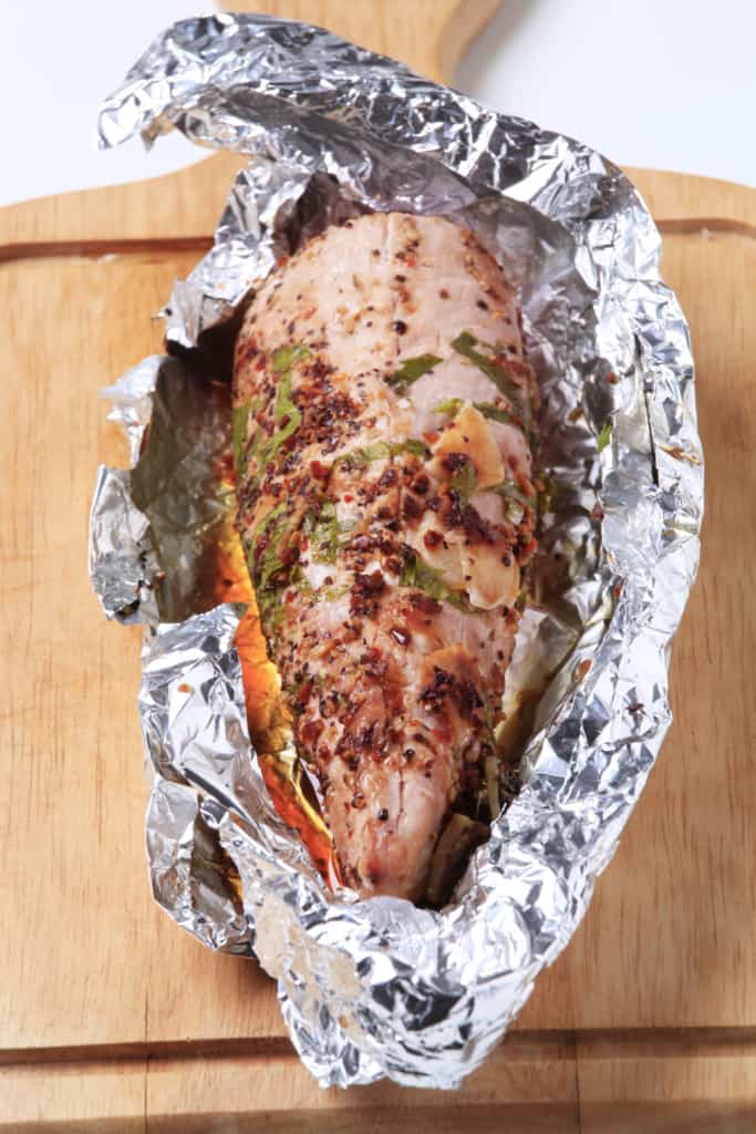 Pork tenderloin wrapped in aluminum foil