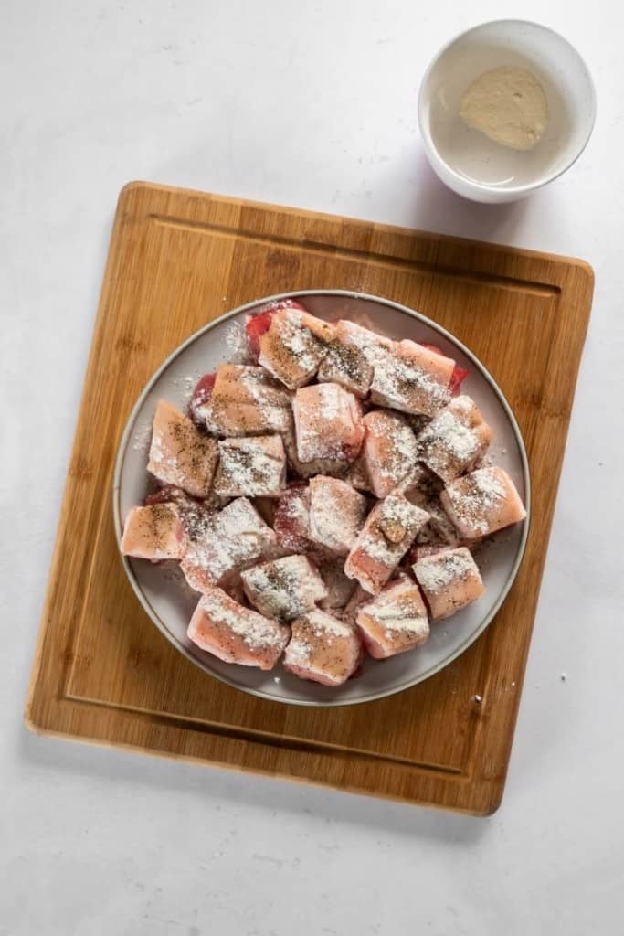 Pork belly with baking powder and seasonings on it ready to be air fried.