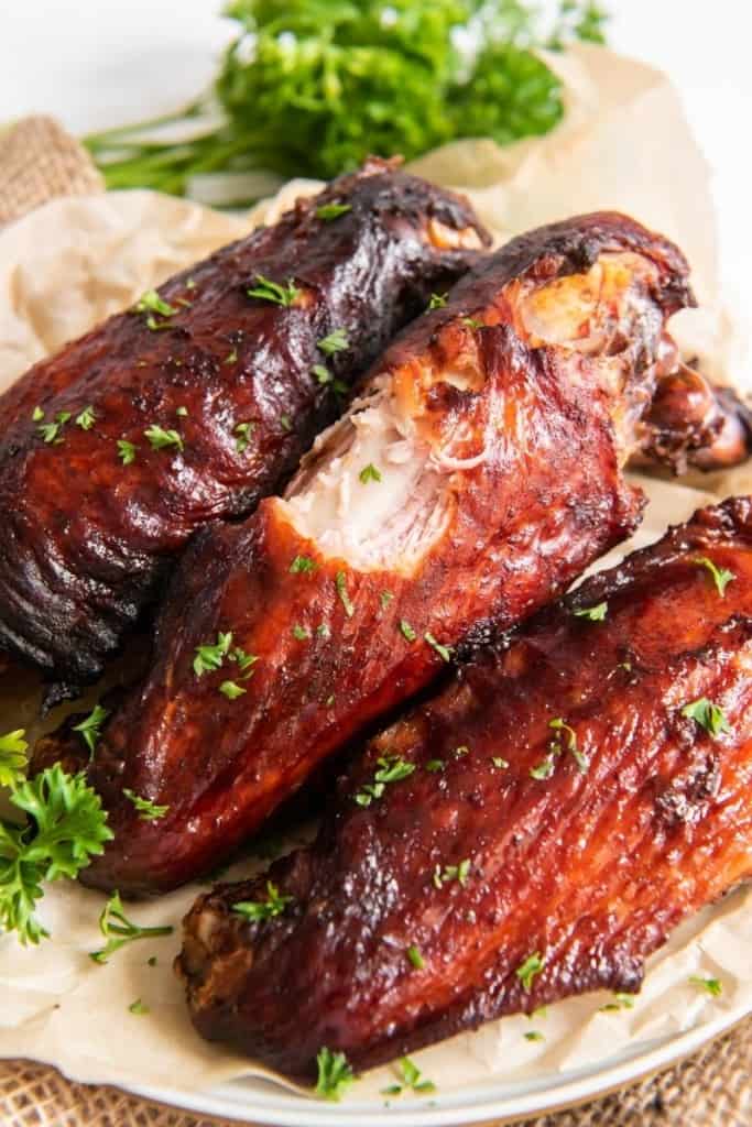 Air fryer smoked turkey wings with a bite taken out of one of the wings