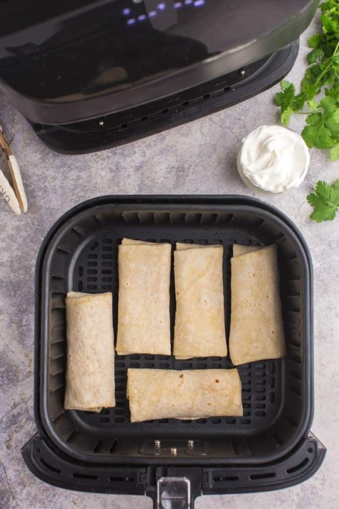 Frozen burritos in air fryer basket