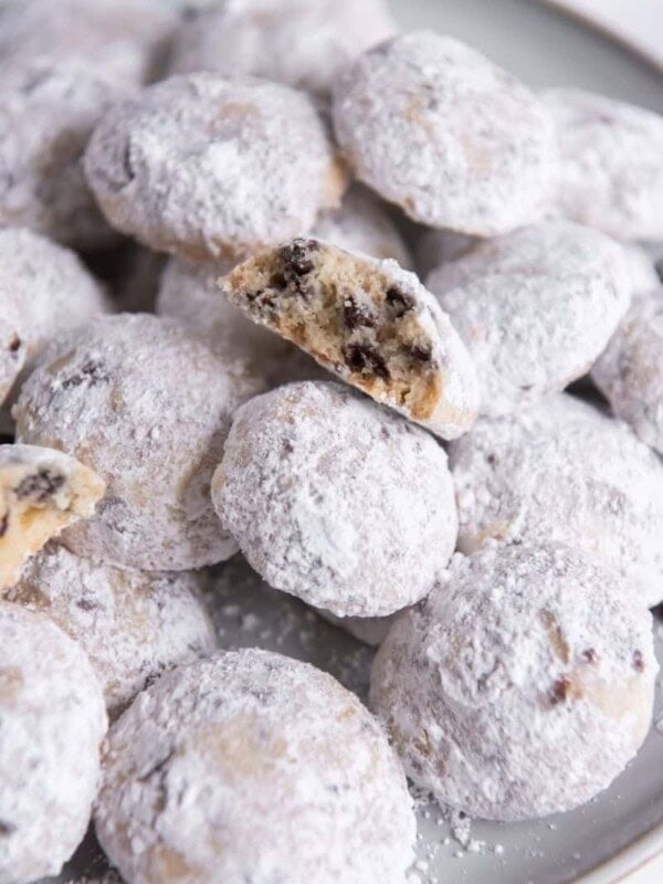 Snowball Cookies with Chocolate chips served on a grey round plate