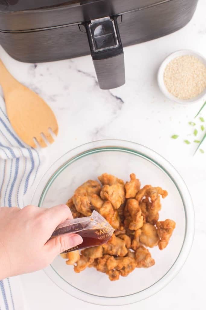 drizzle warm sauce over air fryer mandarin orange chicken