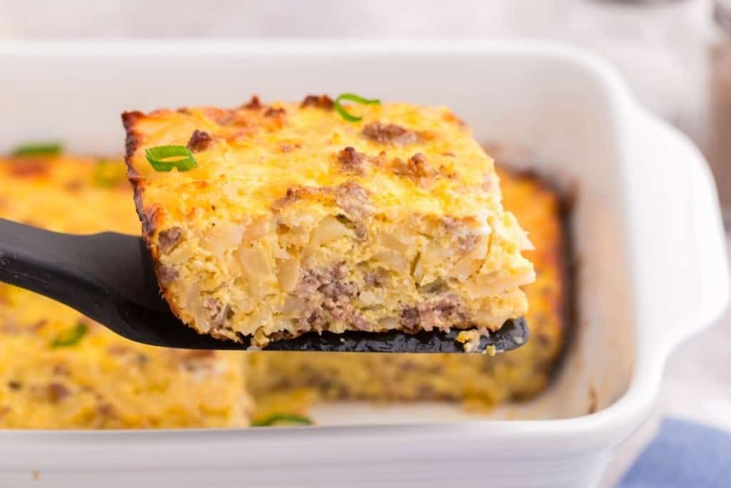 square of hash brown casserole on spatula