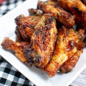 Plated air fryer bbq chicken wings on a rectangular white serving plate.