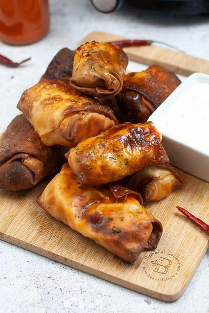 Stack of air fryer buffalo chicken egg rolls
