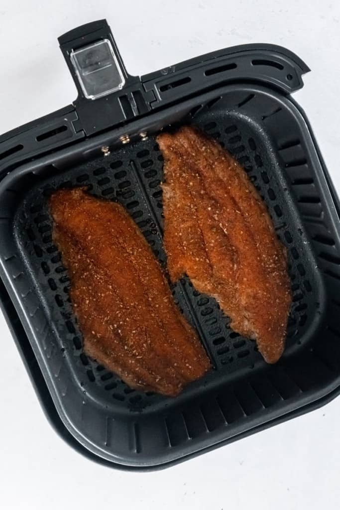 place seasoned fillets side by side in air fryer