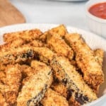 Full plate of breaded eggplant fries from air fryer