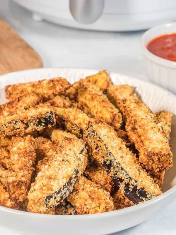 Full plate of breaded eggplant fries from air fryer
