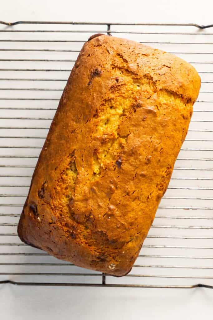 4 ingredient banana bread cooked on a wired cooling rack.