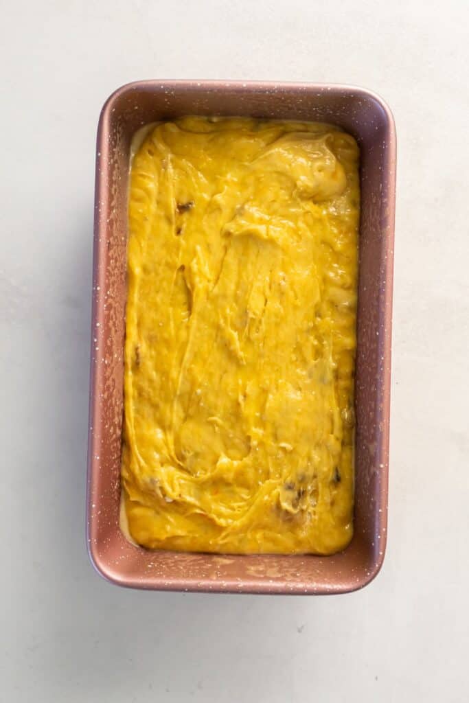 Raw easy banana bread in a bread loaf pan ready to be baked.