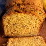 Close up of the banana bread that has been cut into so you can see the moist texture of the bread on the inside.